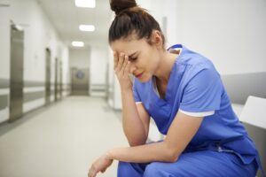 Female nurse suffering from headache